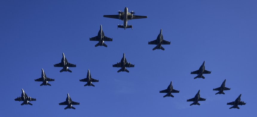 U.S. Navy and Marine Corps aircraft assigned to Carrier Air Wing 11 fly in close formation during a flight demonstration as part of Tiger Cruise 2017 aboard the aircraft carrier USS Nimitz (CVN 68), Nov. 30, 2017, in the Pacific Ocean.