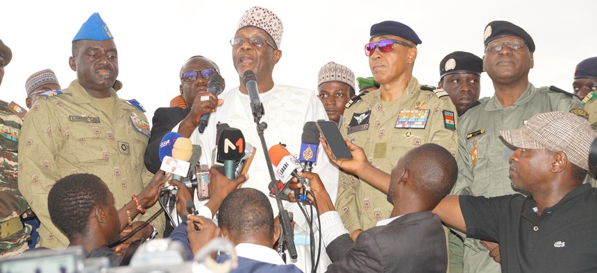 Bakary Yaou Sangare (3rd L), who was made foreign minister after the coup, gives a speech during a protest held outside the French military base urging the withdrawal of French troops from Niger, October 1, 2023.